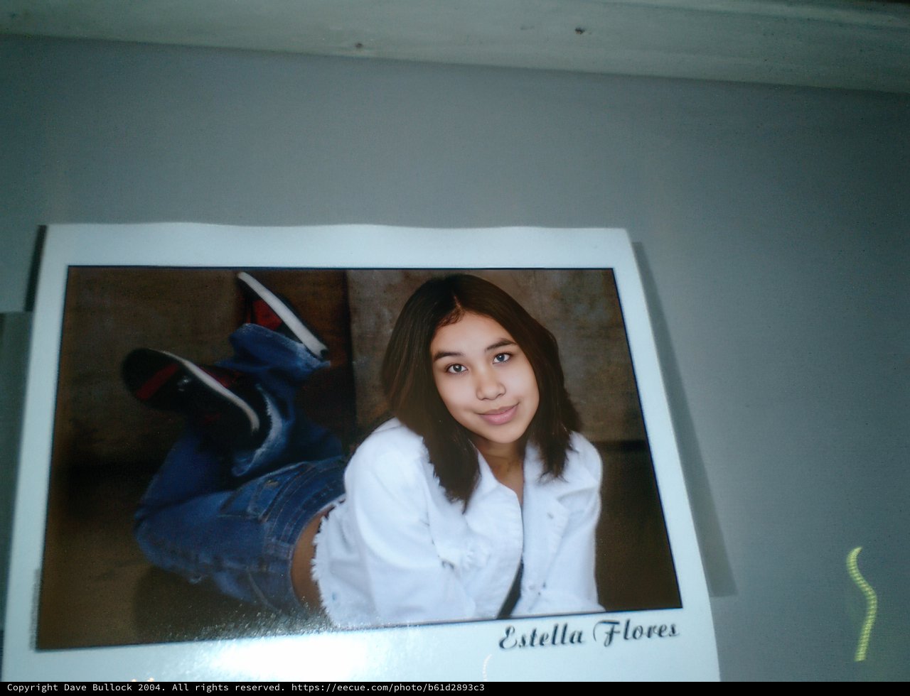 Portrait of a Young Woman in Jeans and White Shirt