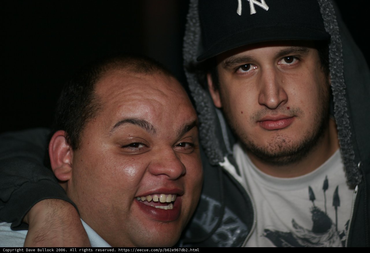 Two Men Smiling for a Snapshot