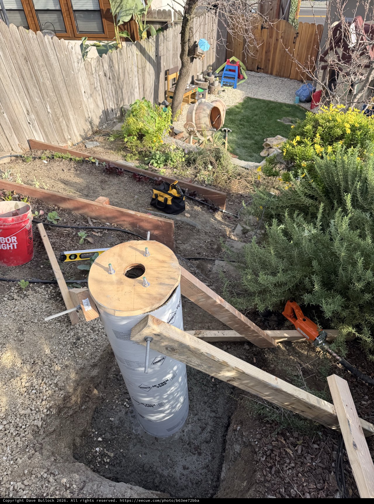 DIY Backyard Deck Foundation Construction in Progress