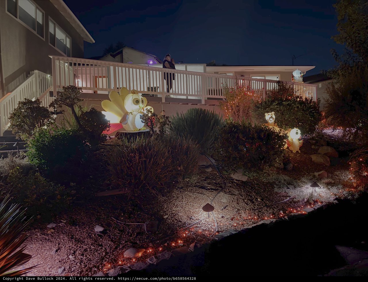 Nighttime Halloween Yard Display with Inflatable Decorations