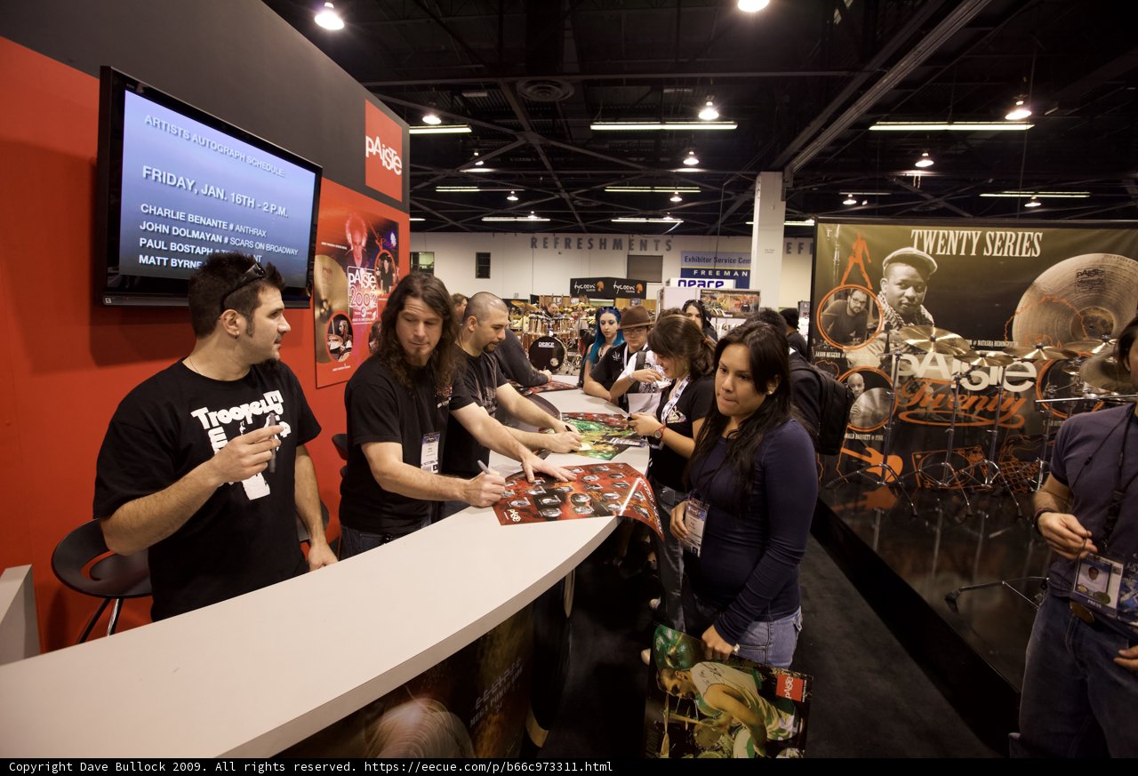 Convention-goers gather around electronics display