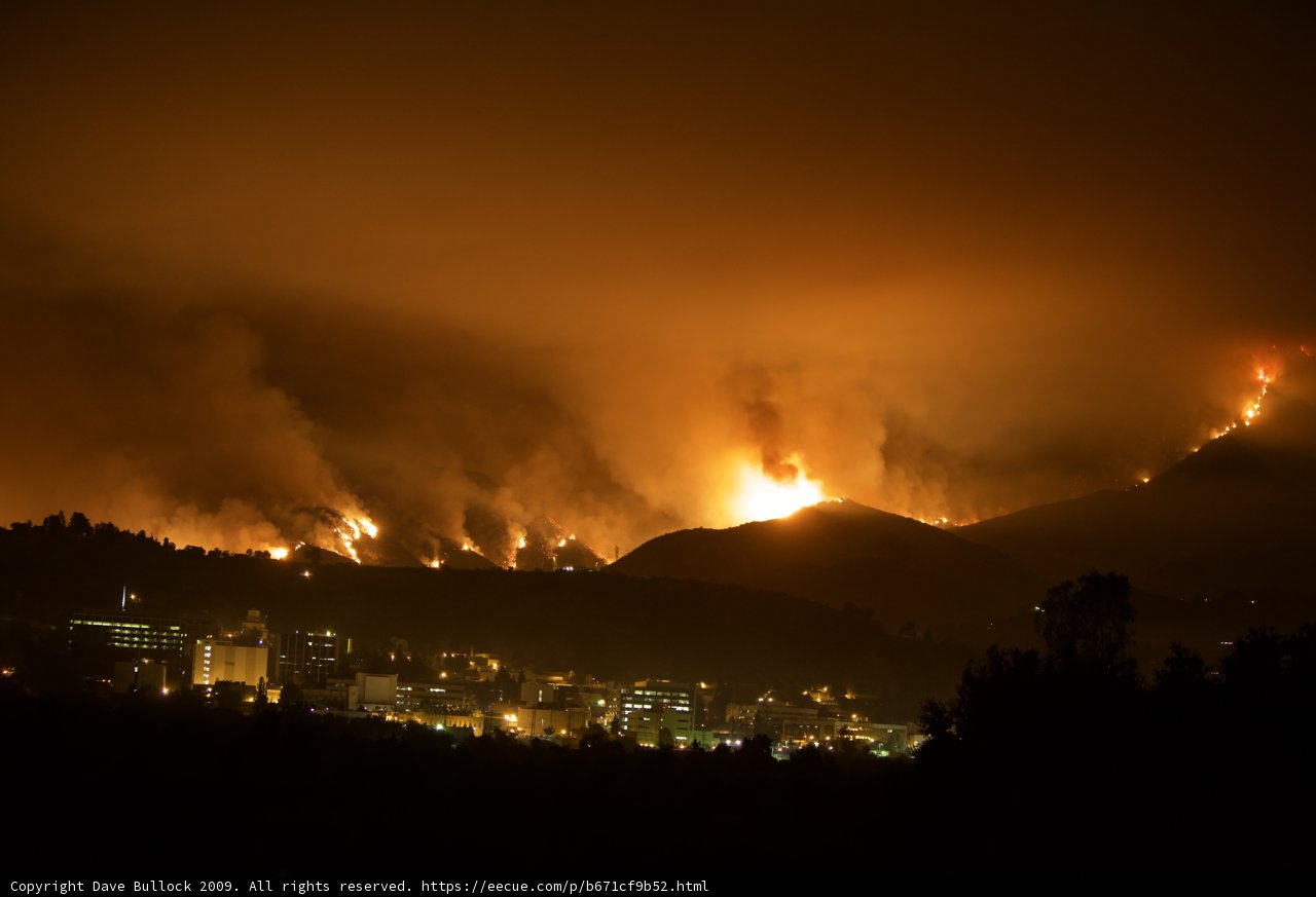 Flames Ravaging the Hills Above the City