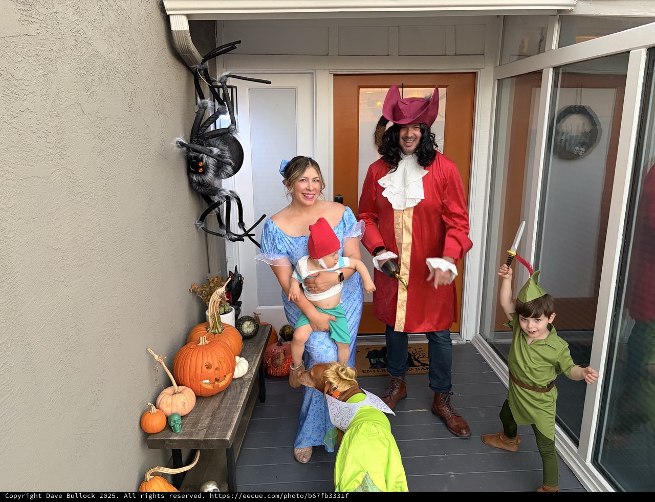 Family Peter Pan Halloween Costume Portrait on Decorated Porch