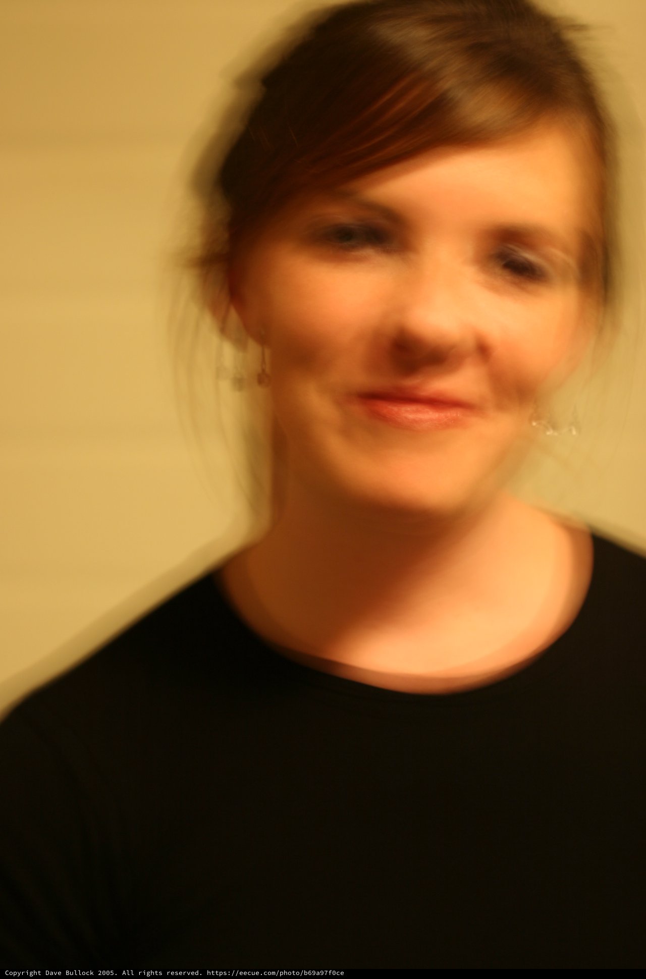 Soft Focus Portrait of Smiling Woman in Black