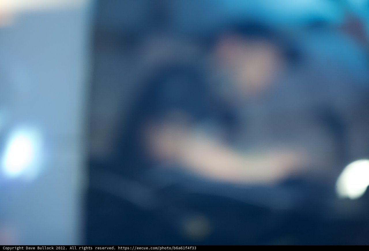 Blurred Man in Dark Room