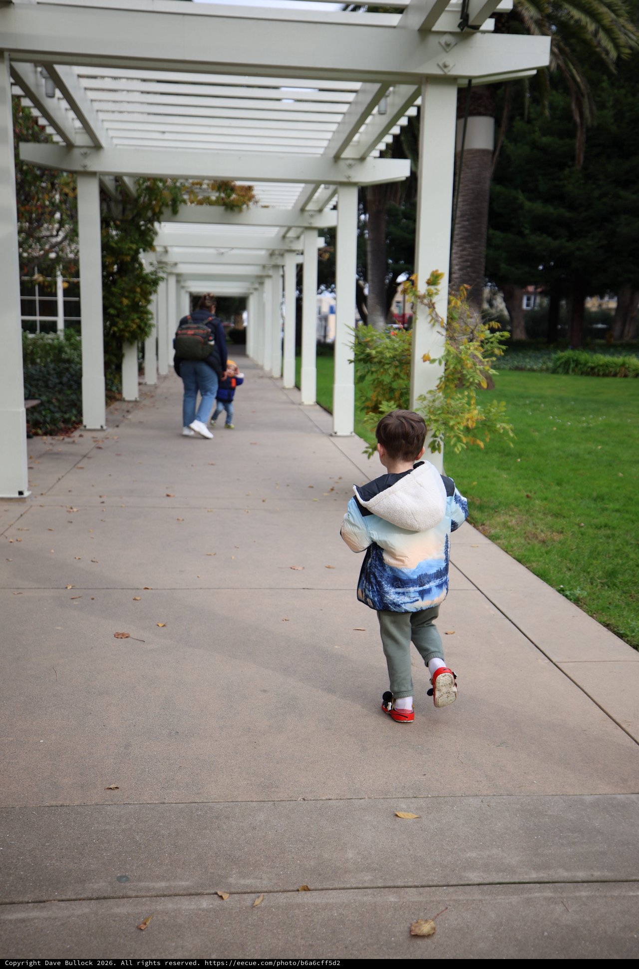 Child Walking Under White Pergola at Skywalker Ranch
