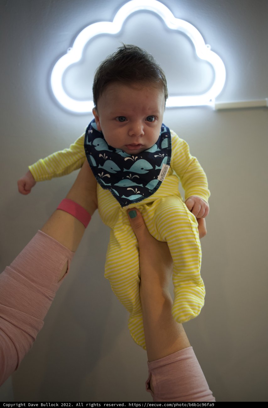 Stripes and Smiles: Baby Wesley at 2 Months