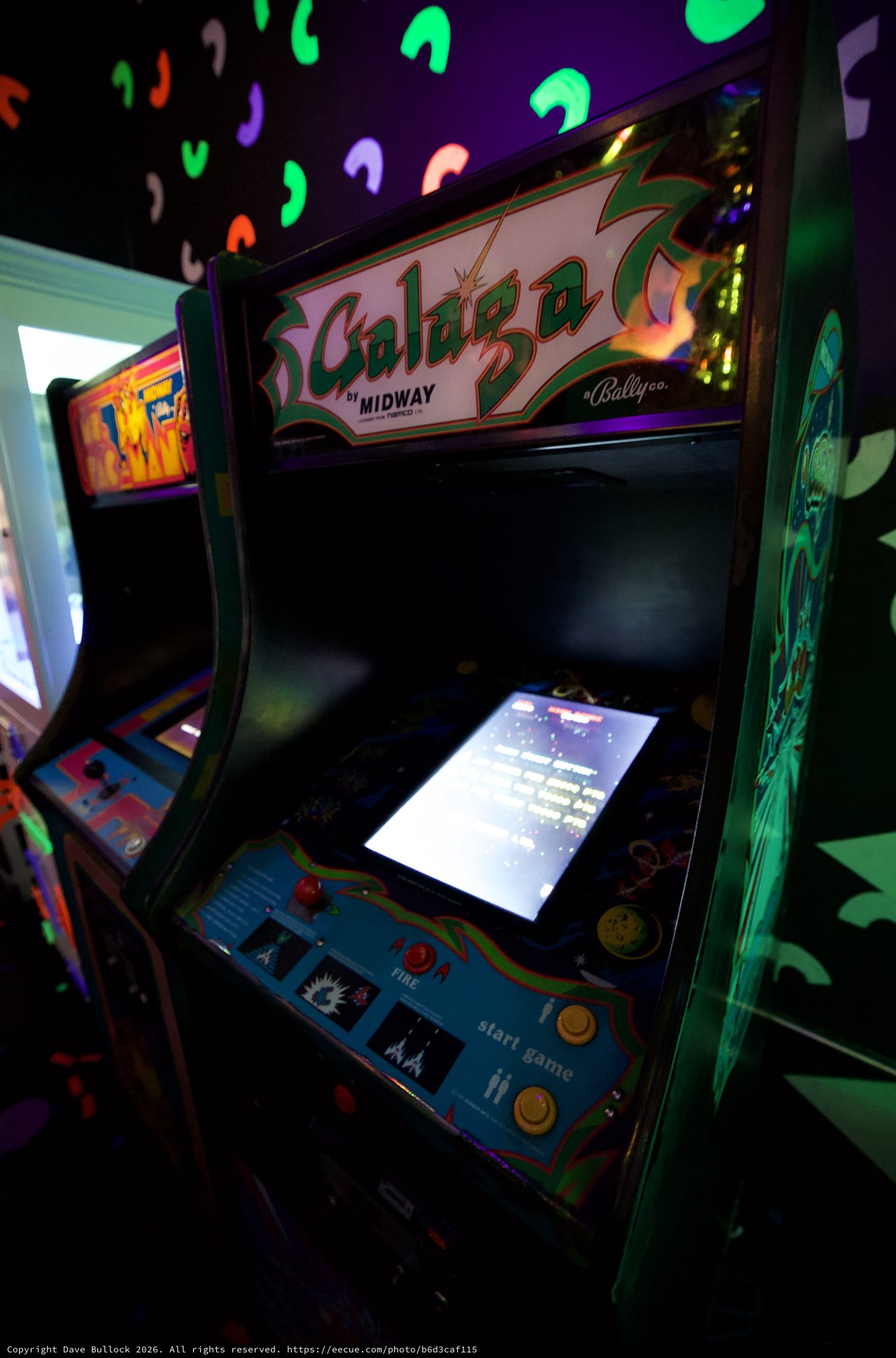 Classic Galaga Arcade Cabinet in Retro Gaming Venue