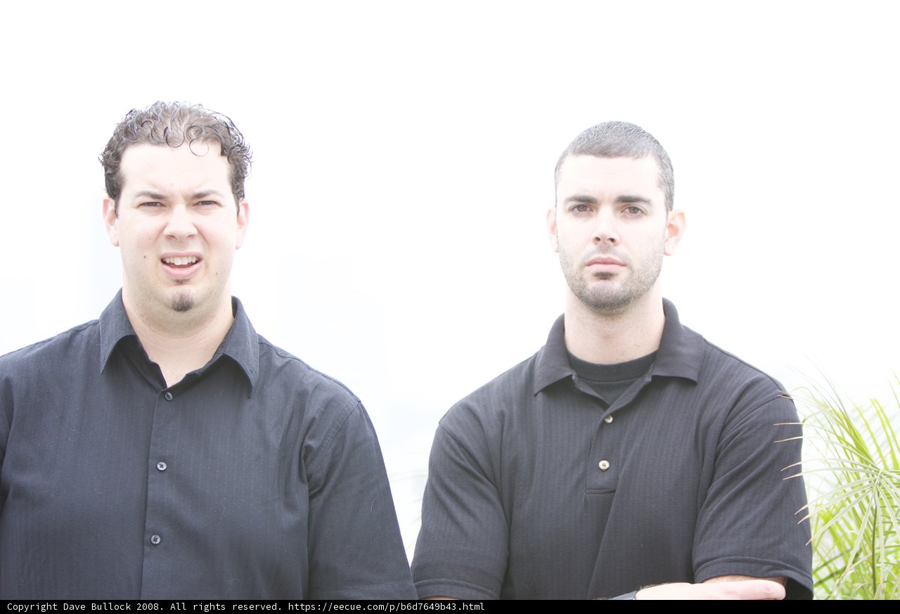 Two Men in Black Shirts