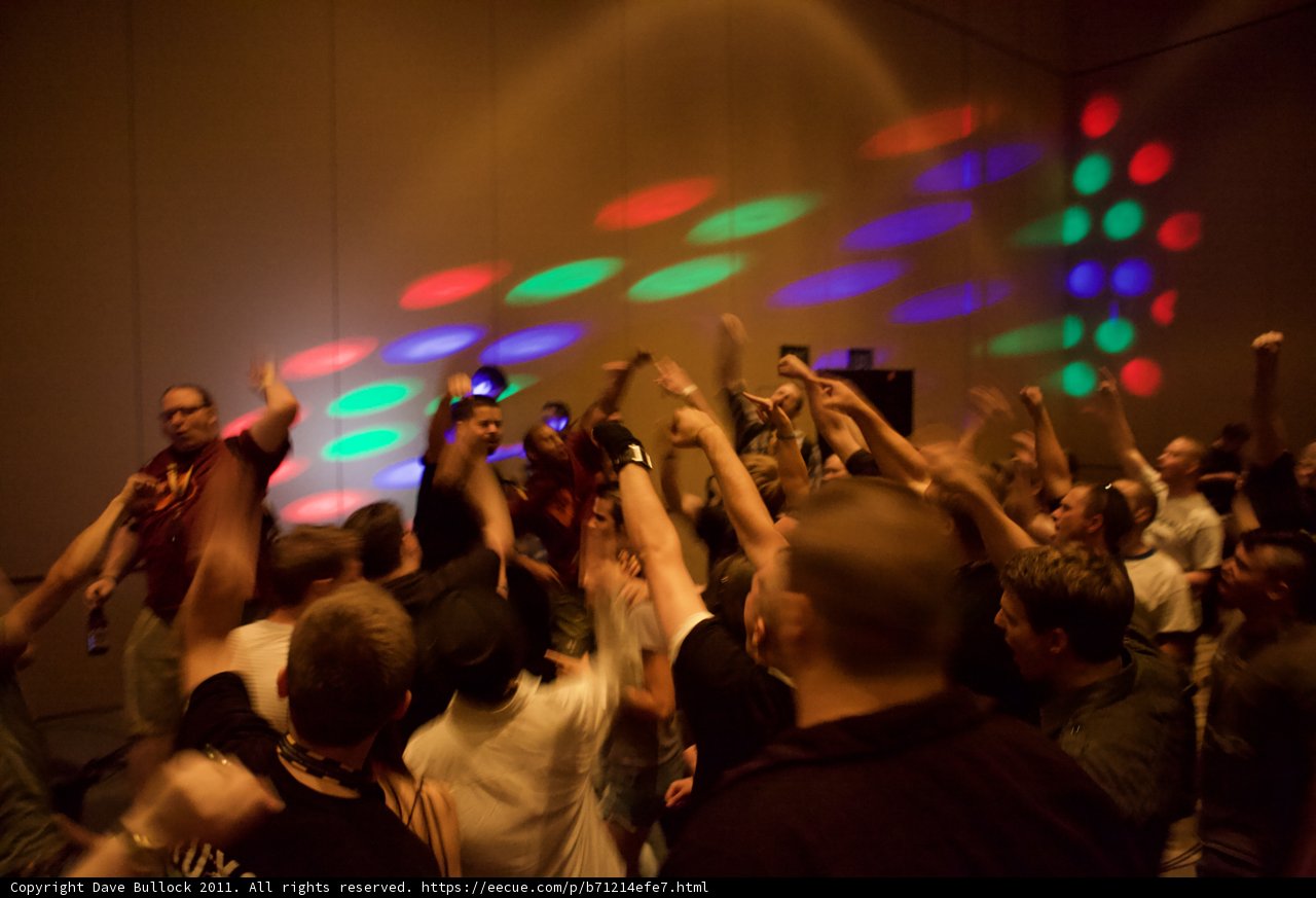 Nightclub Crowd Dancing Under Colorful Lights