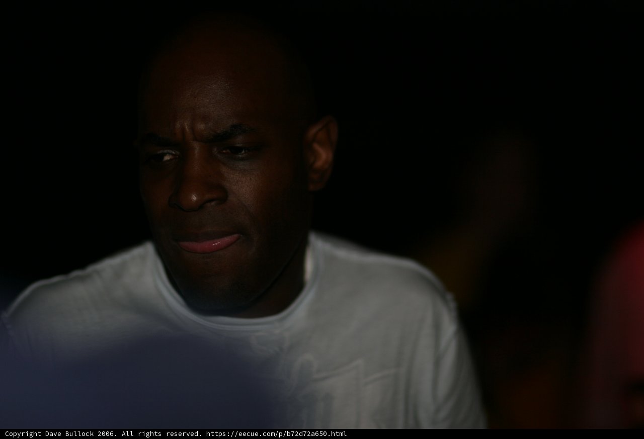 Contemplative MC Q in White T-Shirt