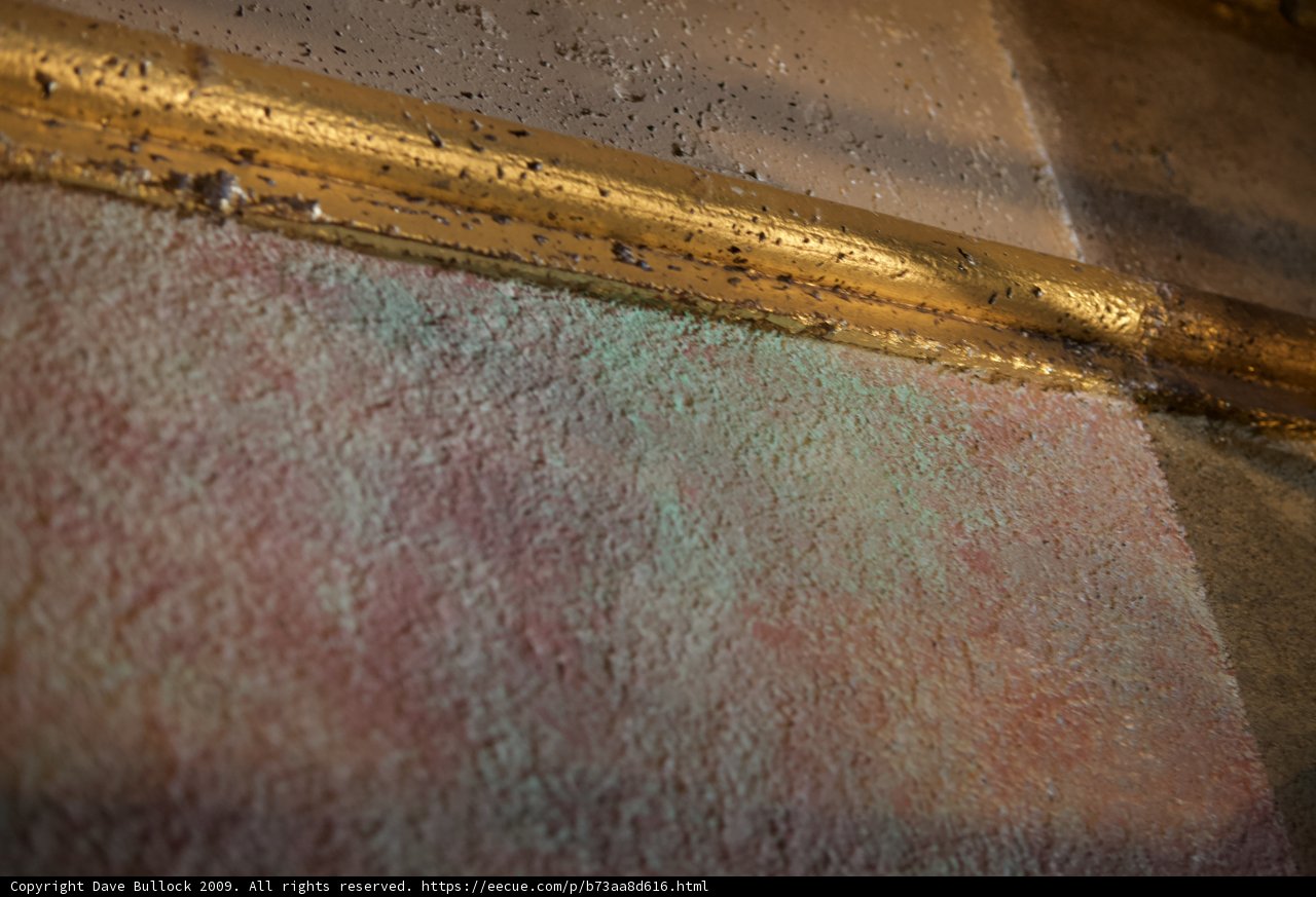 Golden Frame on Textured Wall