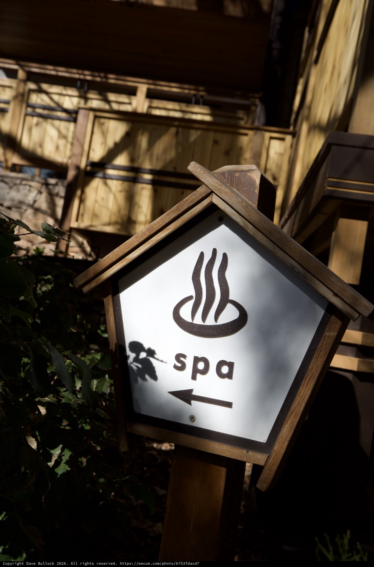 Japanese-Style Spa Directional Sign at Dusk