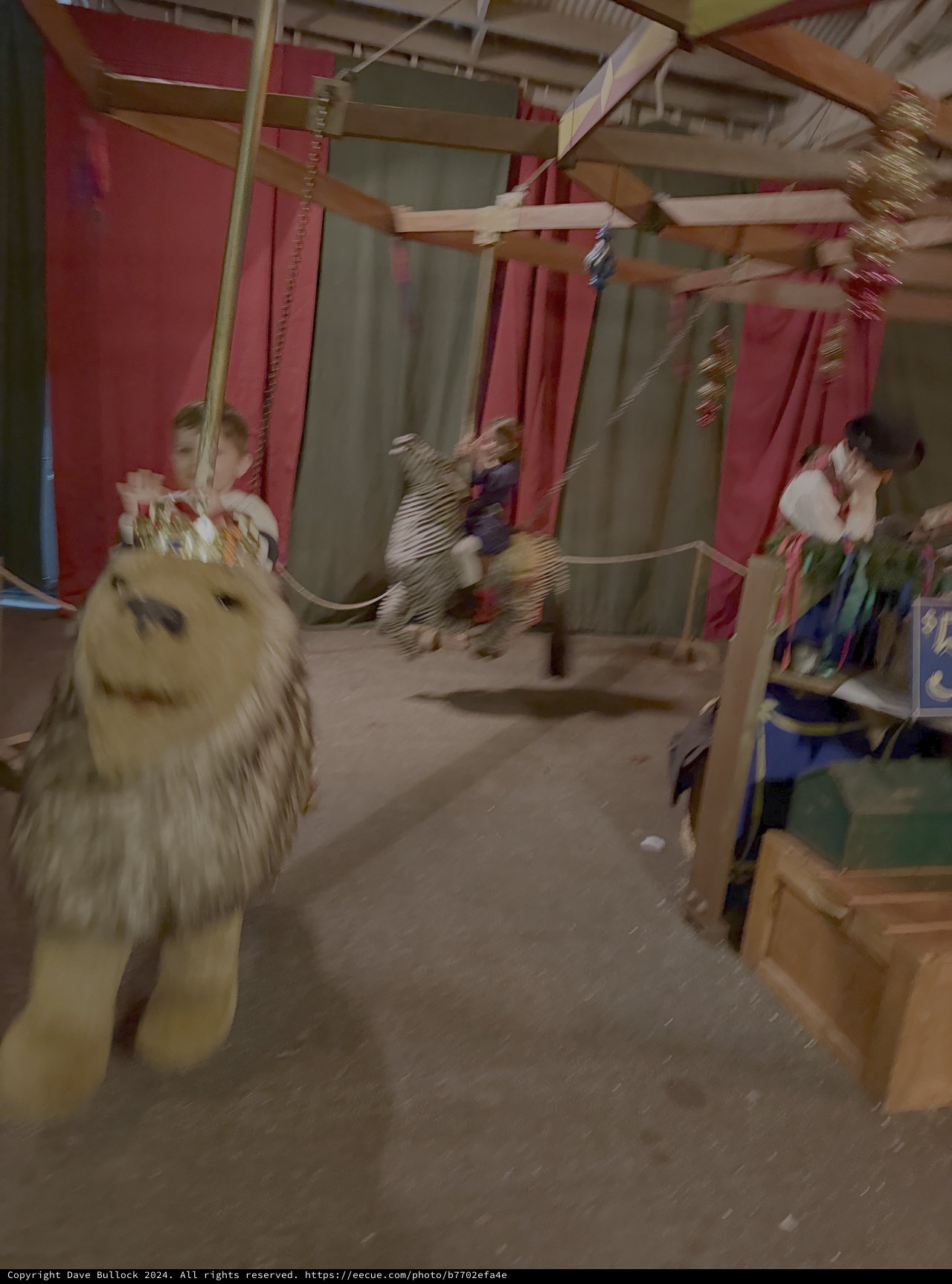 Motion-Blurred Carousel Adventure in Colorful Indoor Setting