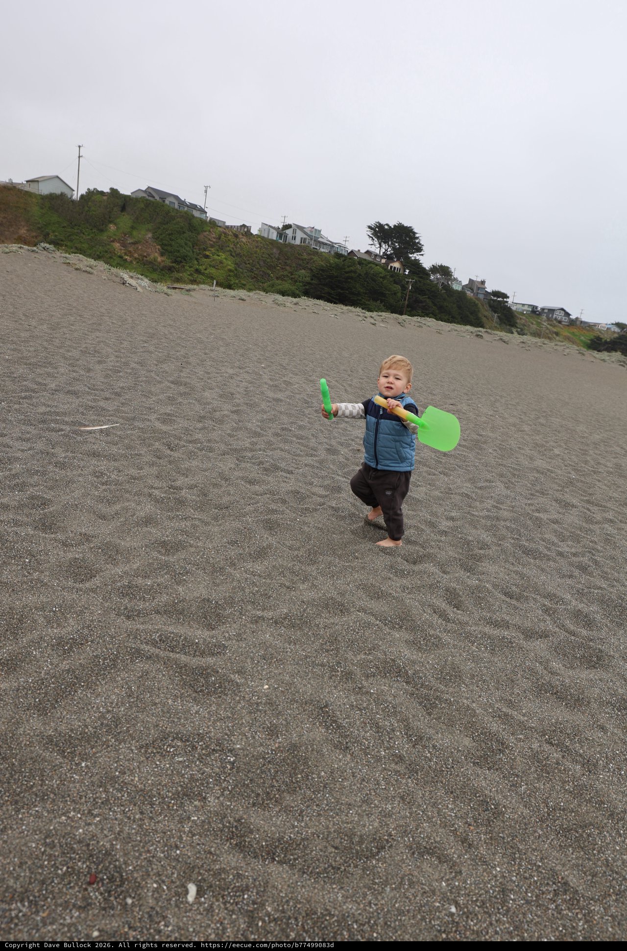 Toddler's Big Adventure on a Gray Beach