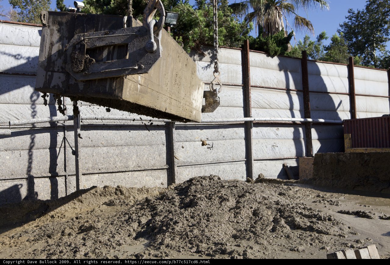 Crane Lifts Dump Truck