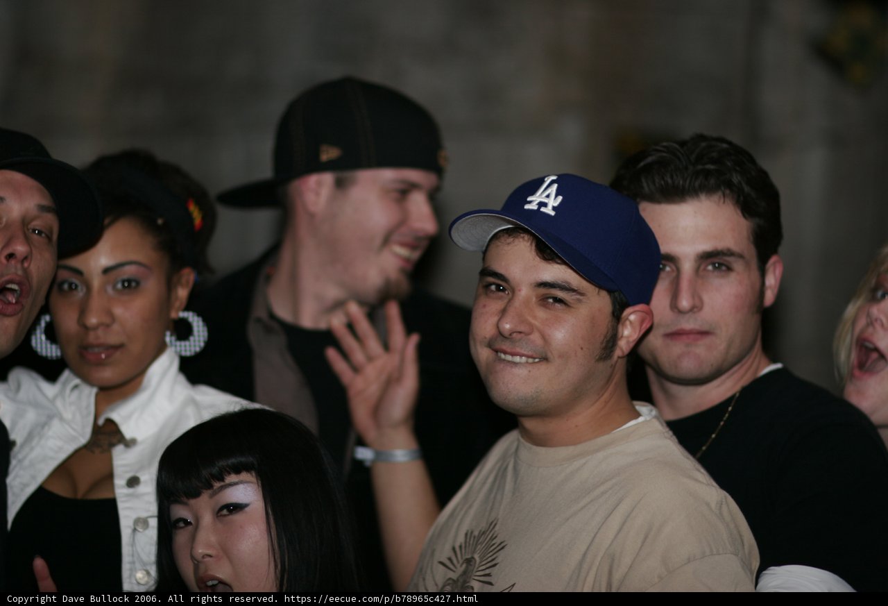 Man in White Shirt and Baseball Cap