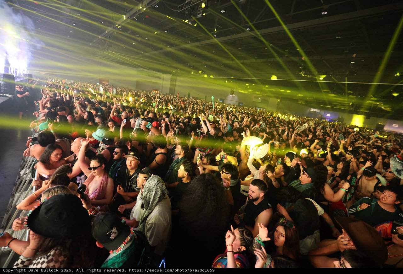 Massive Indoor Crowd Erupts Under Green Laser Lights