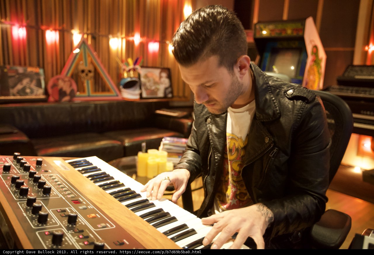 Man in a Leather Jacket Playing Electronic Keyboard