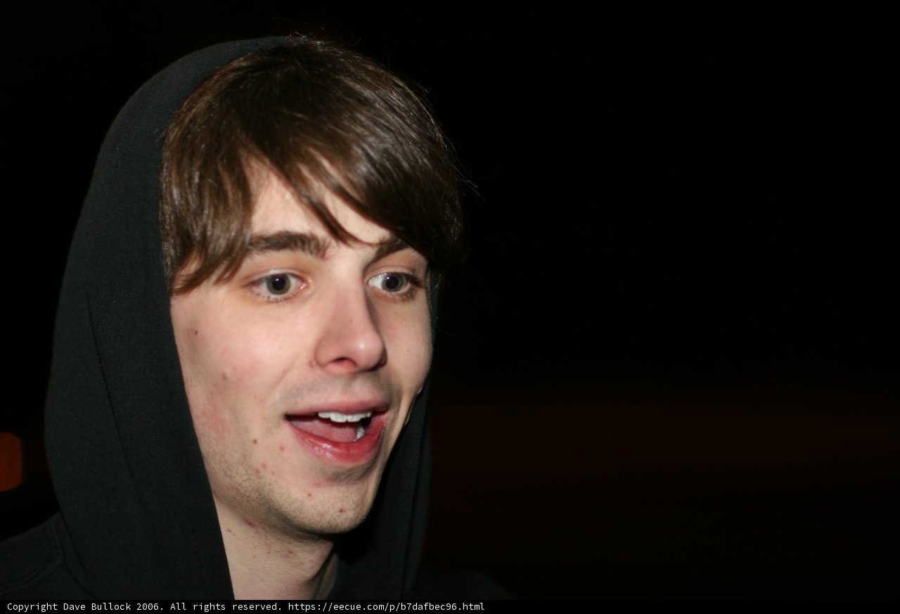Smiling in a Hoodie