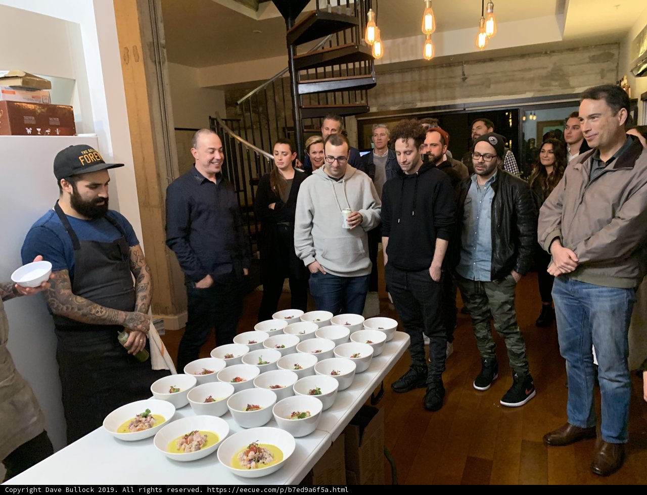 Group of People Enjoying a Meal Together