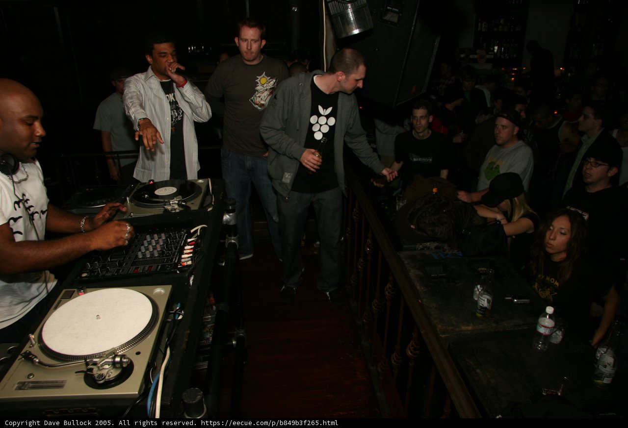 DJ spins tunes for crowded pub