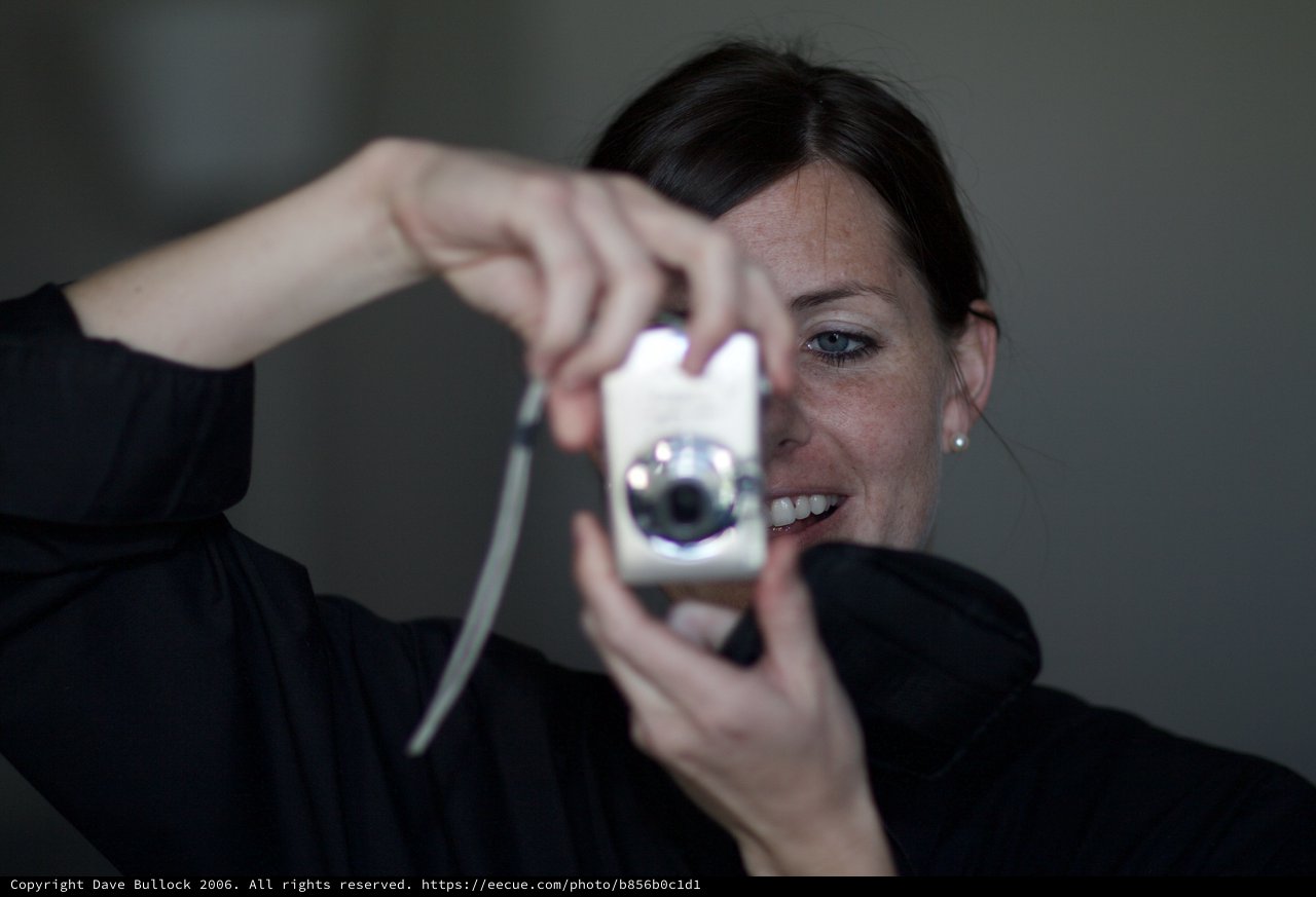 Woman Playfully Holds Camera Toward the Lens