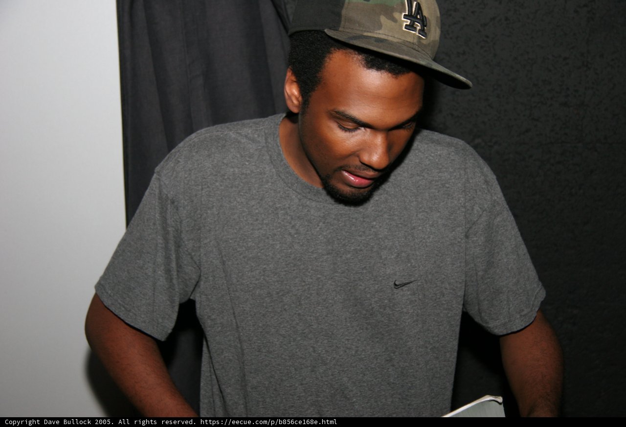 Grey Shirted Man in Baseball Cap