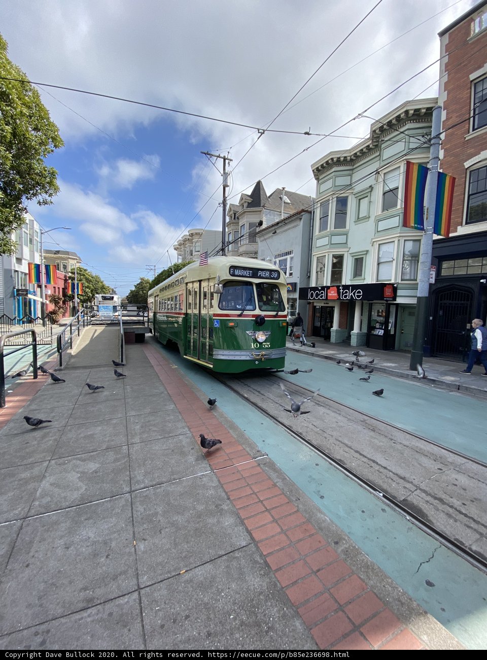 Green and White Trolley in the Heart of San Francisco
