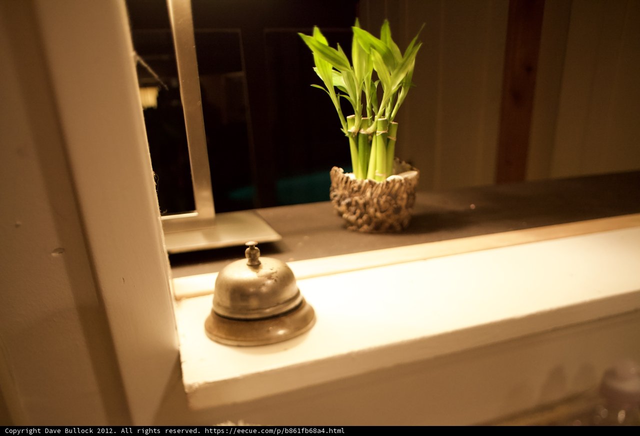 Serene Greenery and a Charming Bell