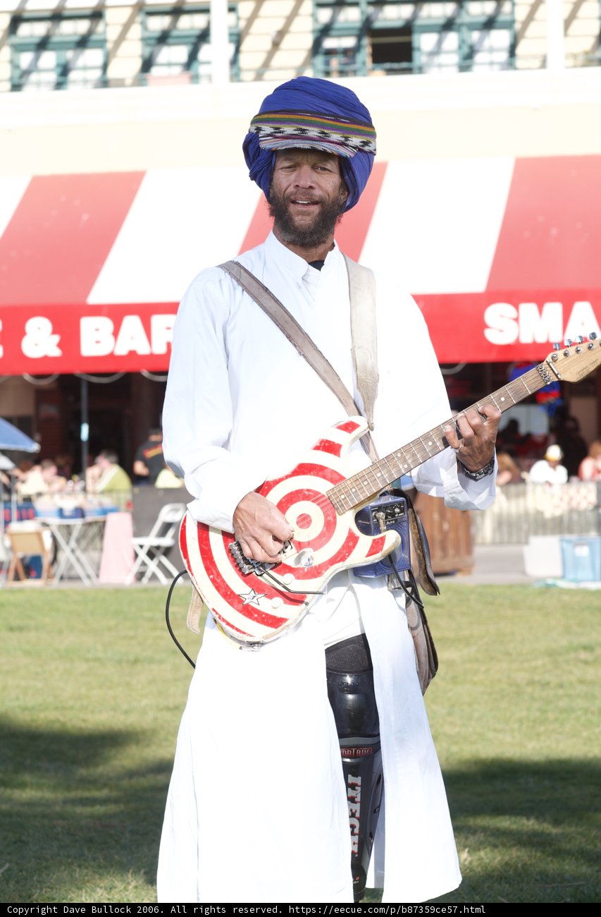 Turbaned Musician Strums His Guitar Outdoors