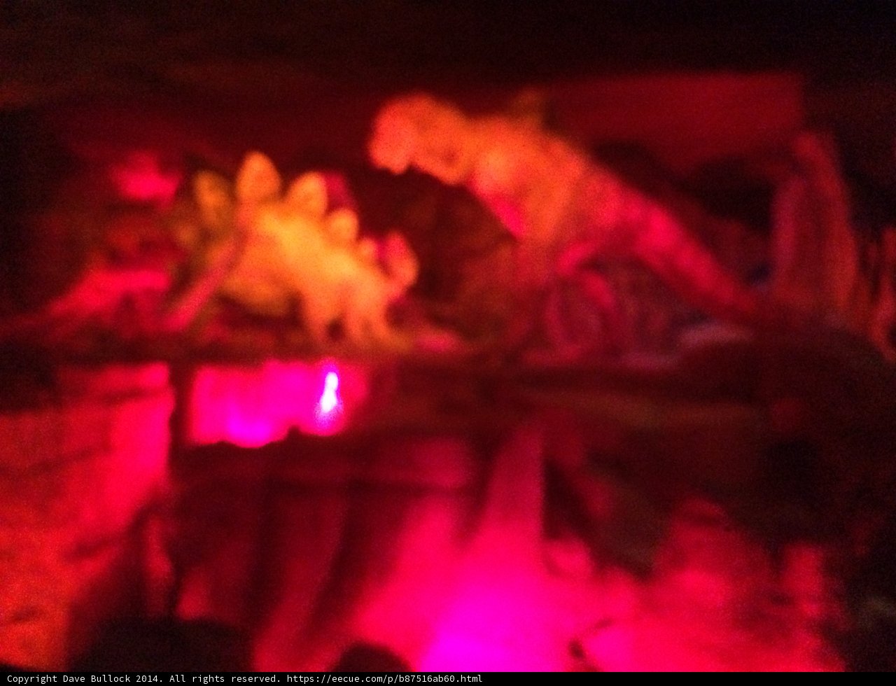 Red-Lit Dinosaur Statue at Disneyland Night Club