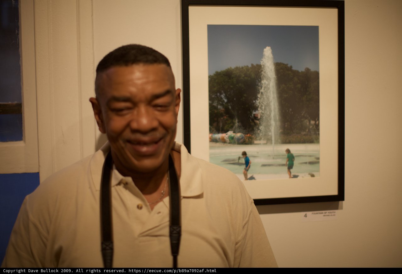Man Admiring Artistic Fountain