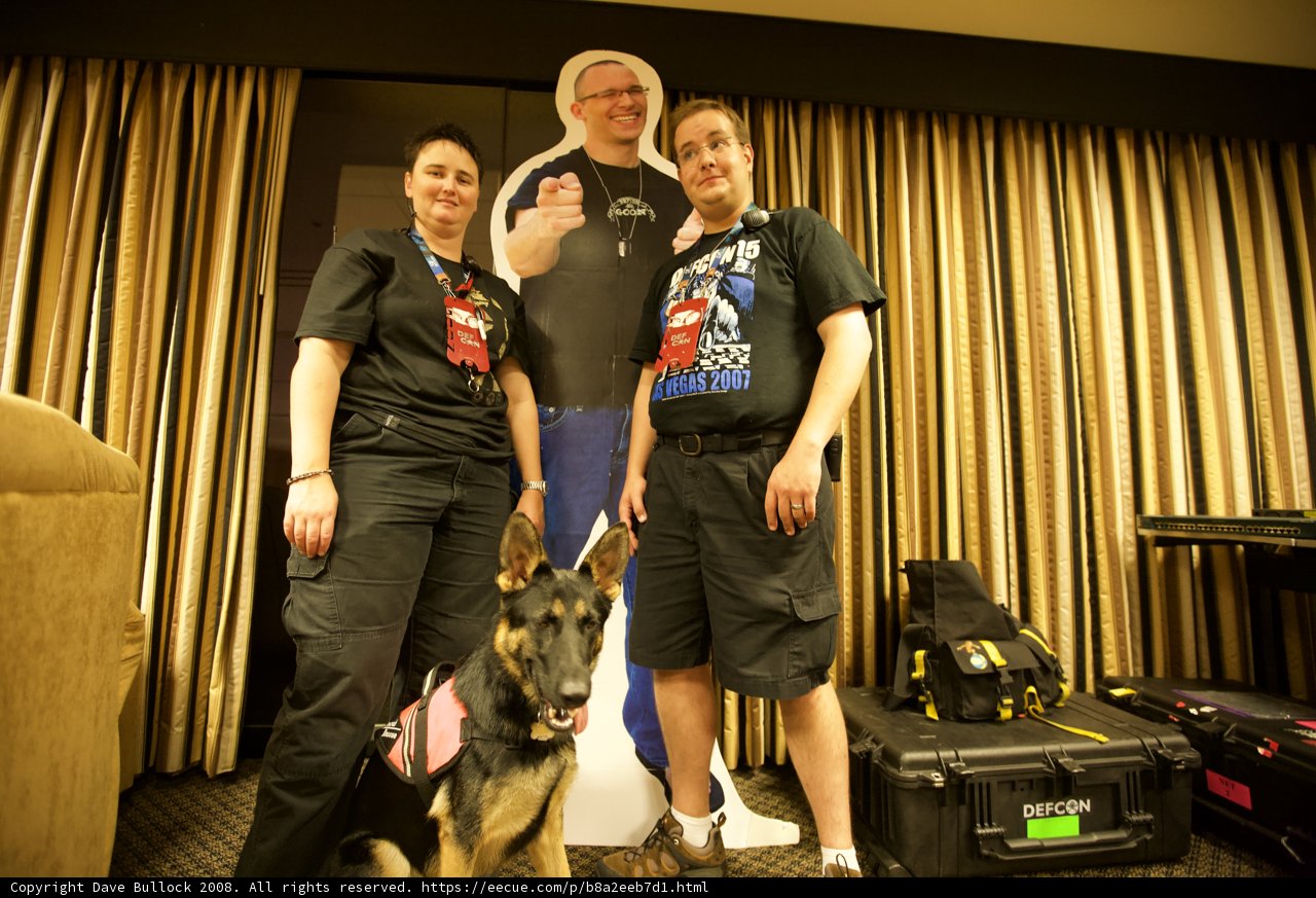 Three people and their police dog