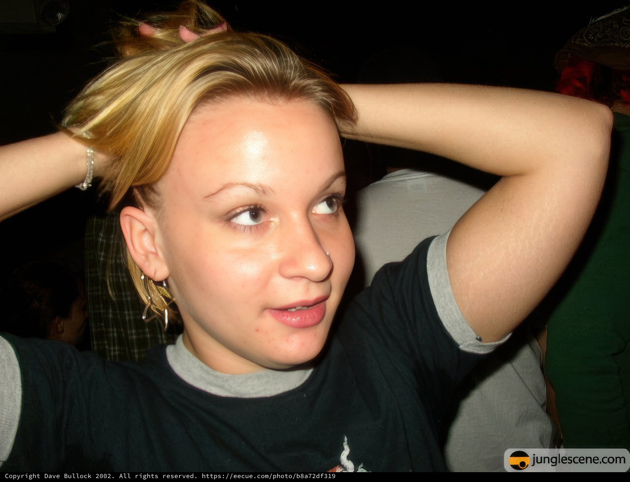 Blonde beauty in a T-shirt and earrings