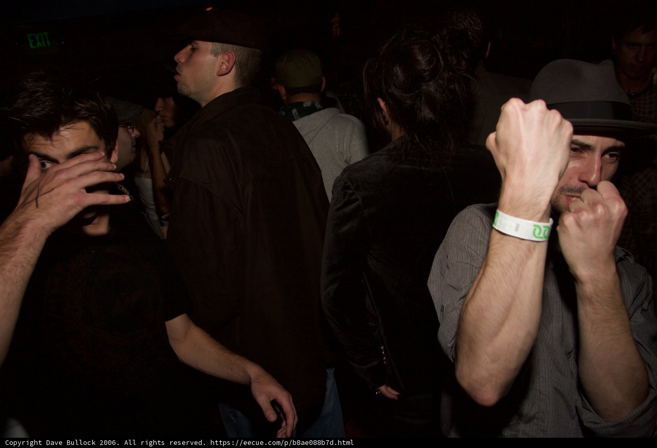 Hand to Face at Night Club