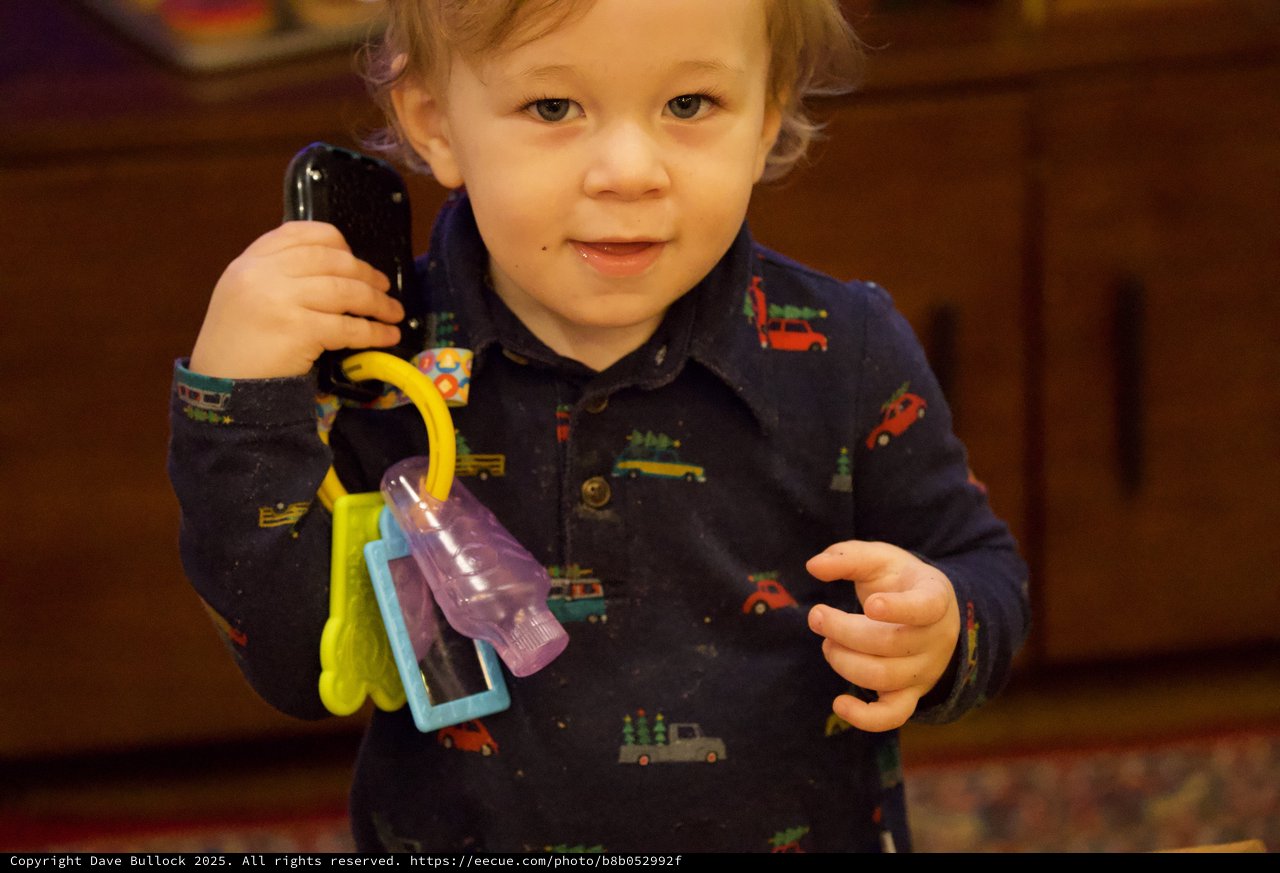 Toddler Playing with Toy Keys and Phone at Christmas