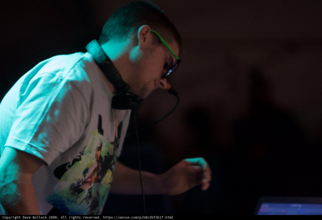 Man in T-Shirt Performing with Microphone