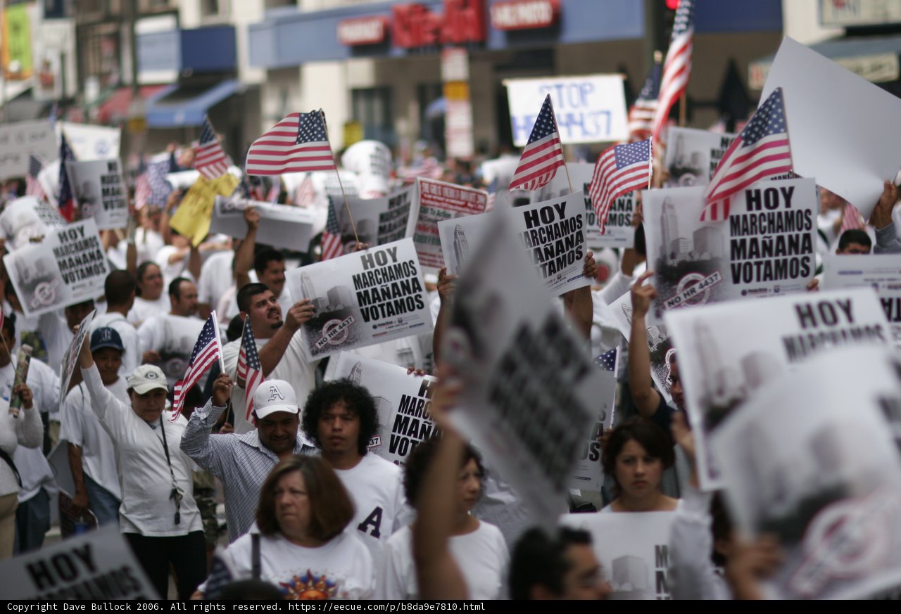 Protest Parade with Flags and Signs