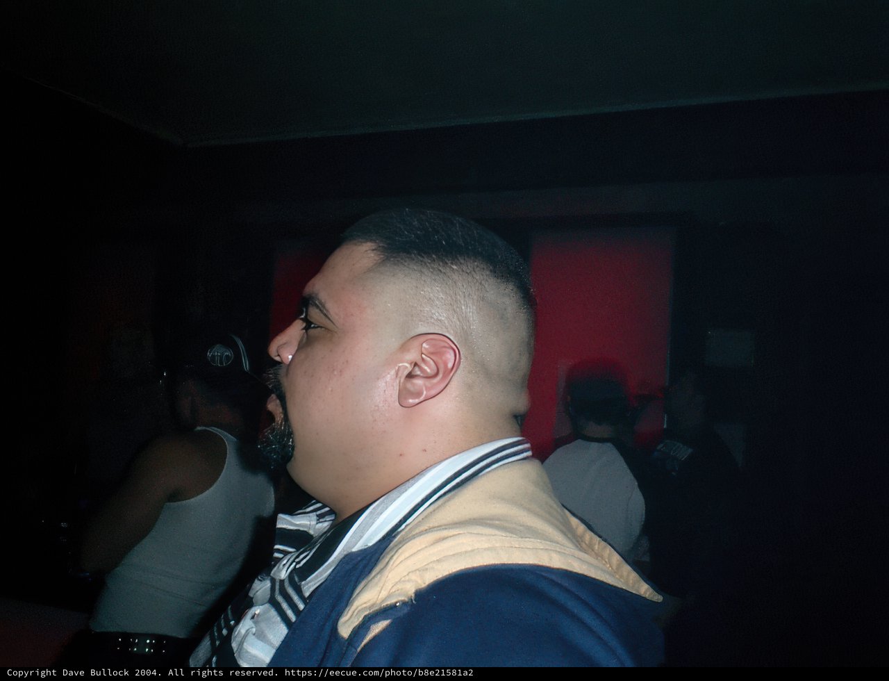 Shaved Head in the Night Club