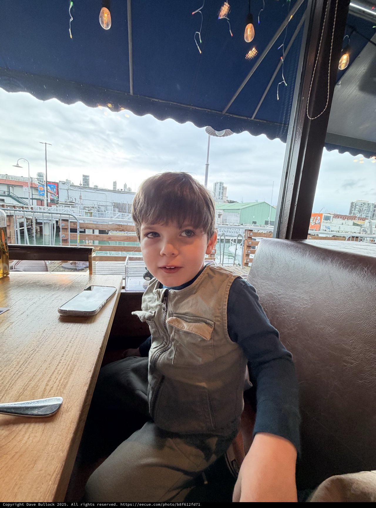 Young Boy at Urban Rooftop Café