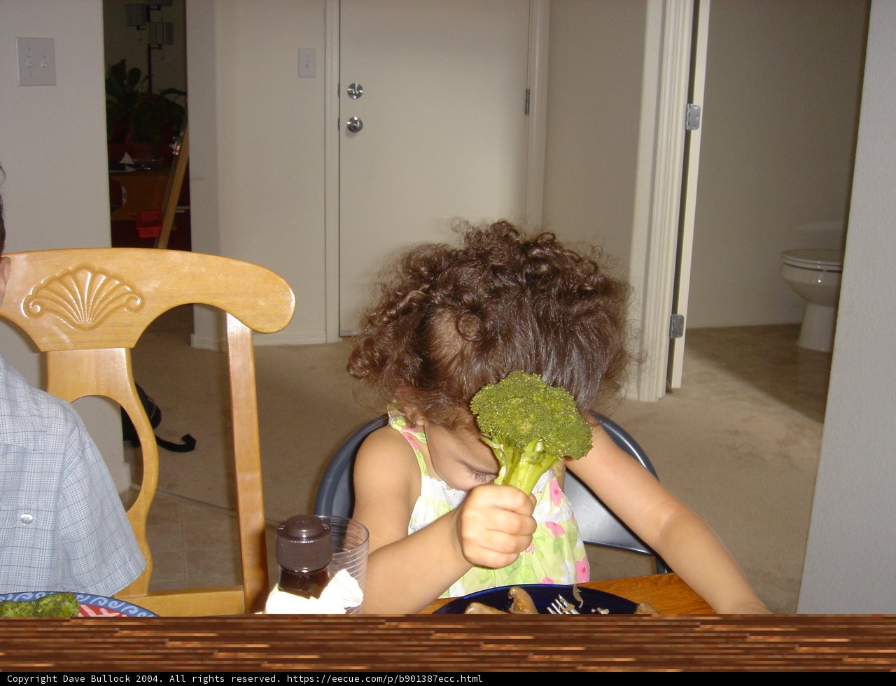 Little boy proudly showing off his healthy snack