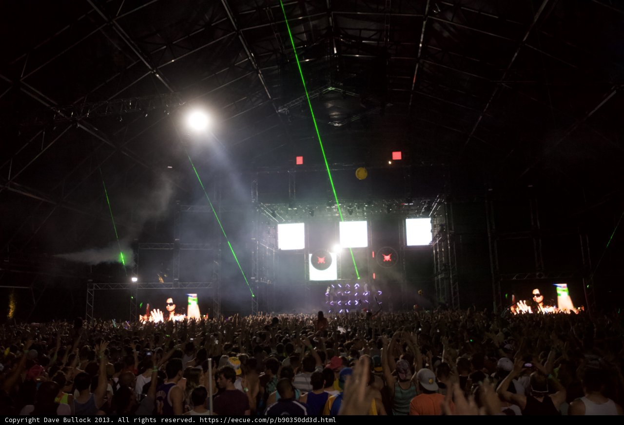 Green Spotlight on a Rocking Crowd