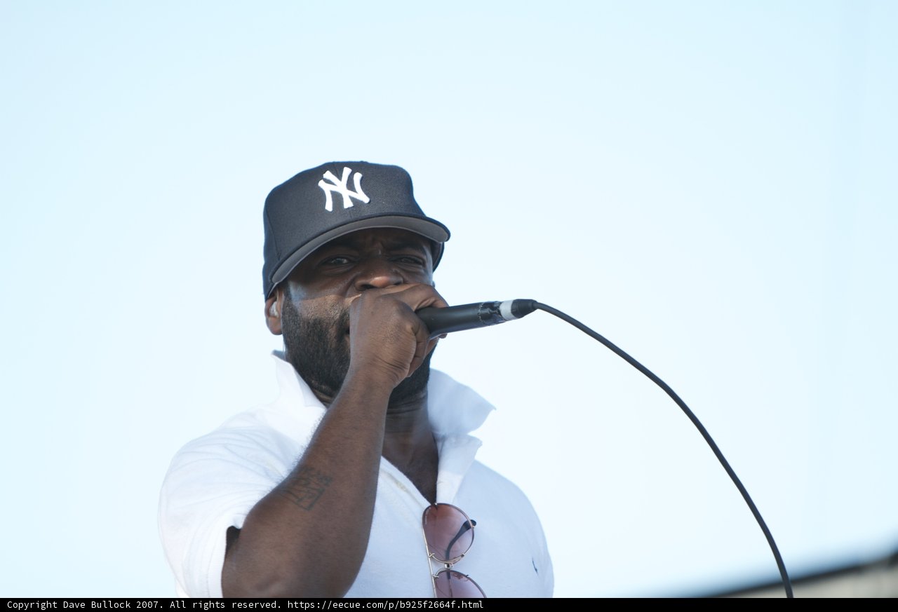 The Solo Performer in a Baseball Cap