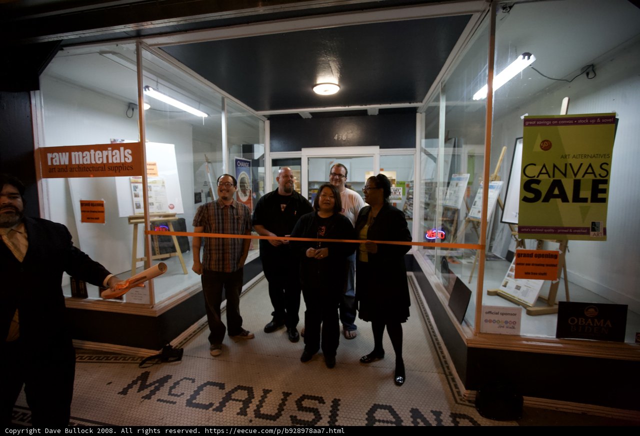 Group of people in front of flooring store