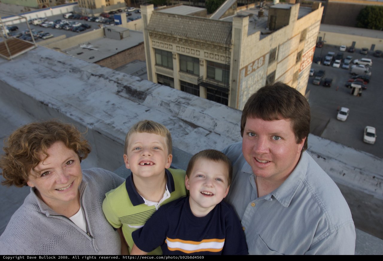 Family Portrait on Rooftop Above Downtown Streets