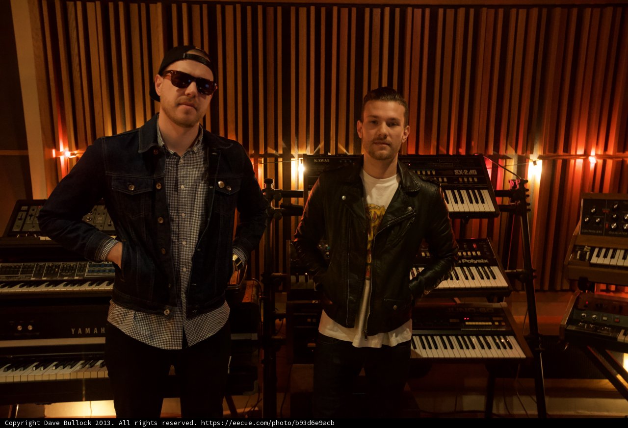 Two Men Jamming on the Keys in the Studio