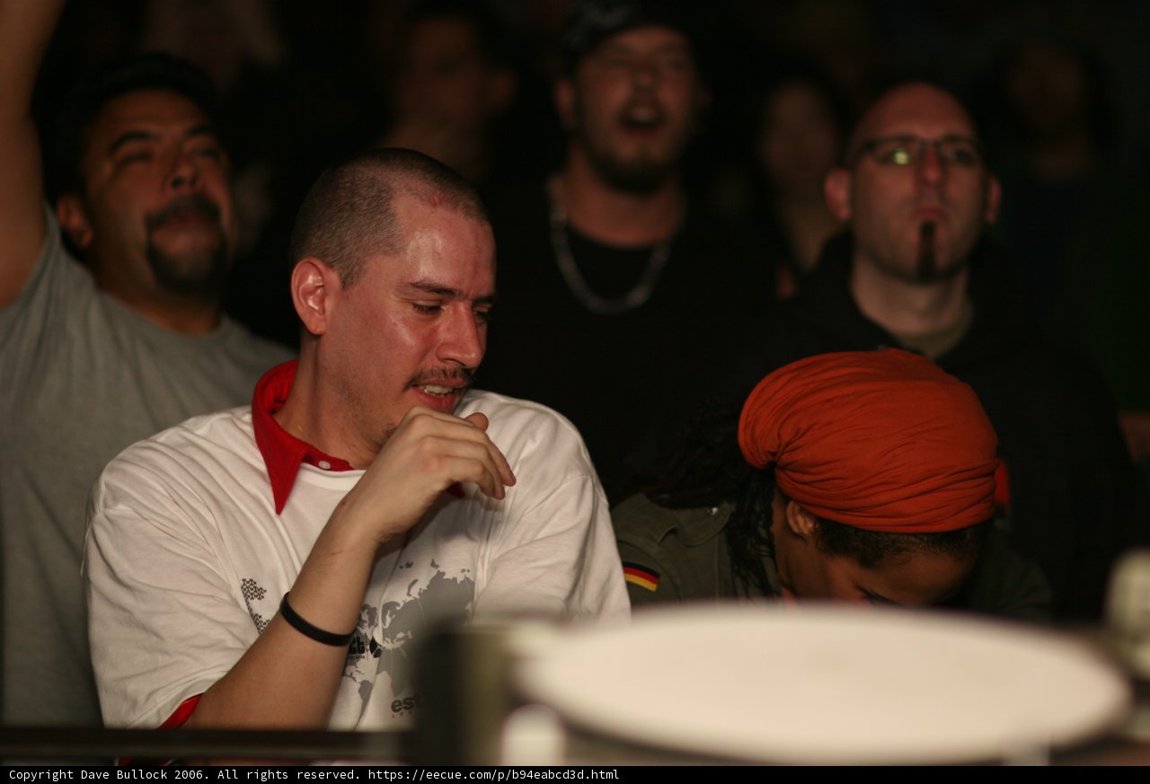 Red-Shirted Man in a Sea of People