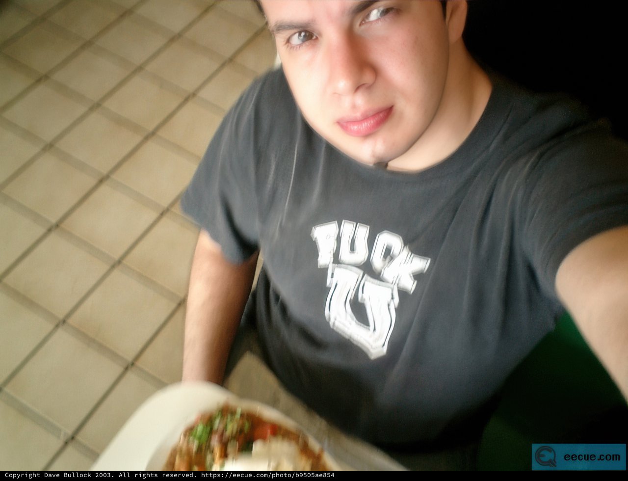 Teen enjoying his lunch at the restaurant
