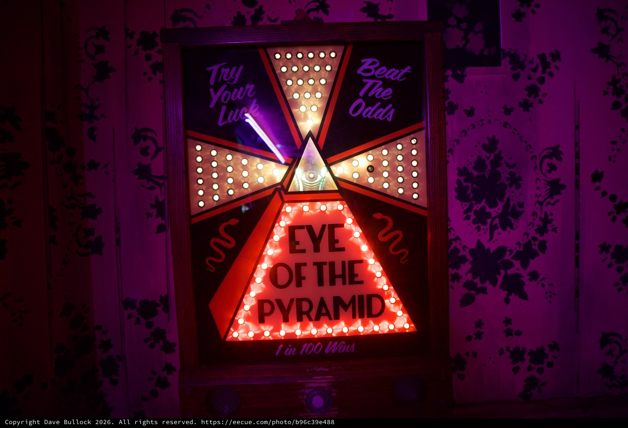 Eye of the Pyramid Carnival Game with Neon Lights